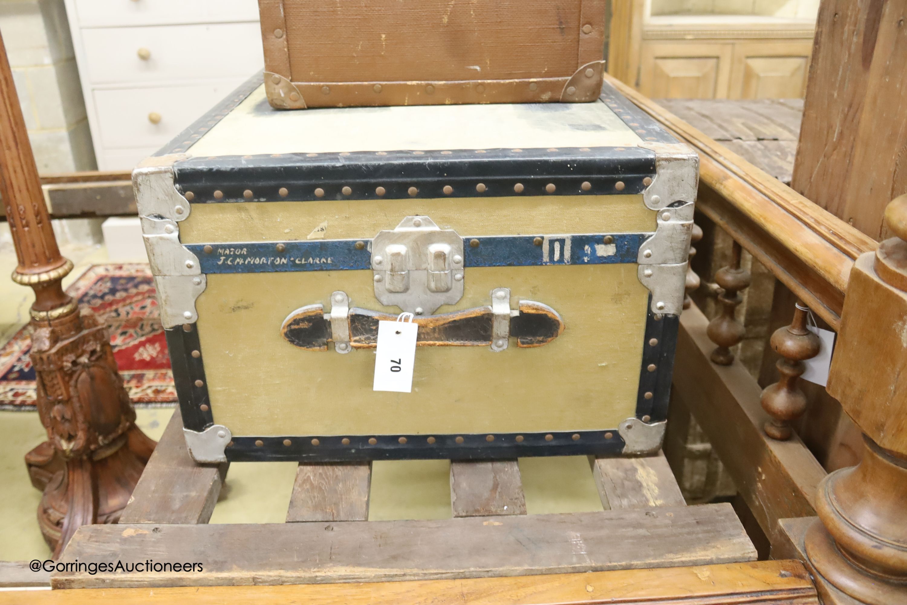 A Victorian tan leather and canvas domed top trunk, width 76cm, depth 60cm high together with two suitcases